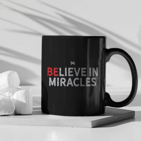 Believe In Miracles - Small Black Coffee Cup, Red Letters - On Table With Marshmallows