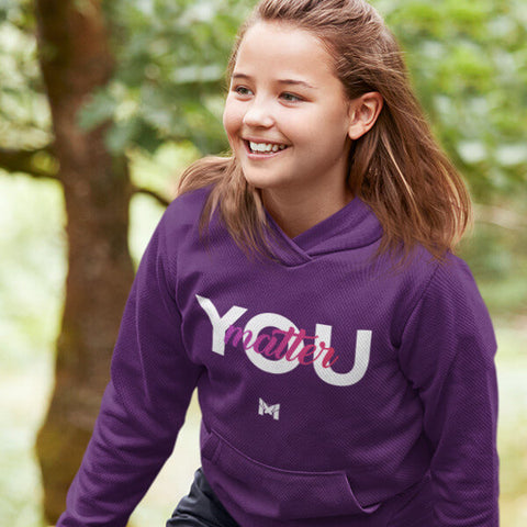 Smiling Happy Girl Wearing Purple "You Matter" Sweatshirt For Kids / Youth
